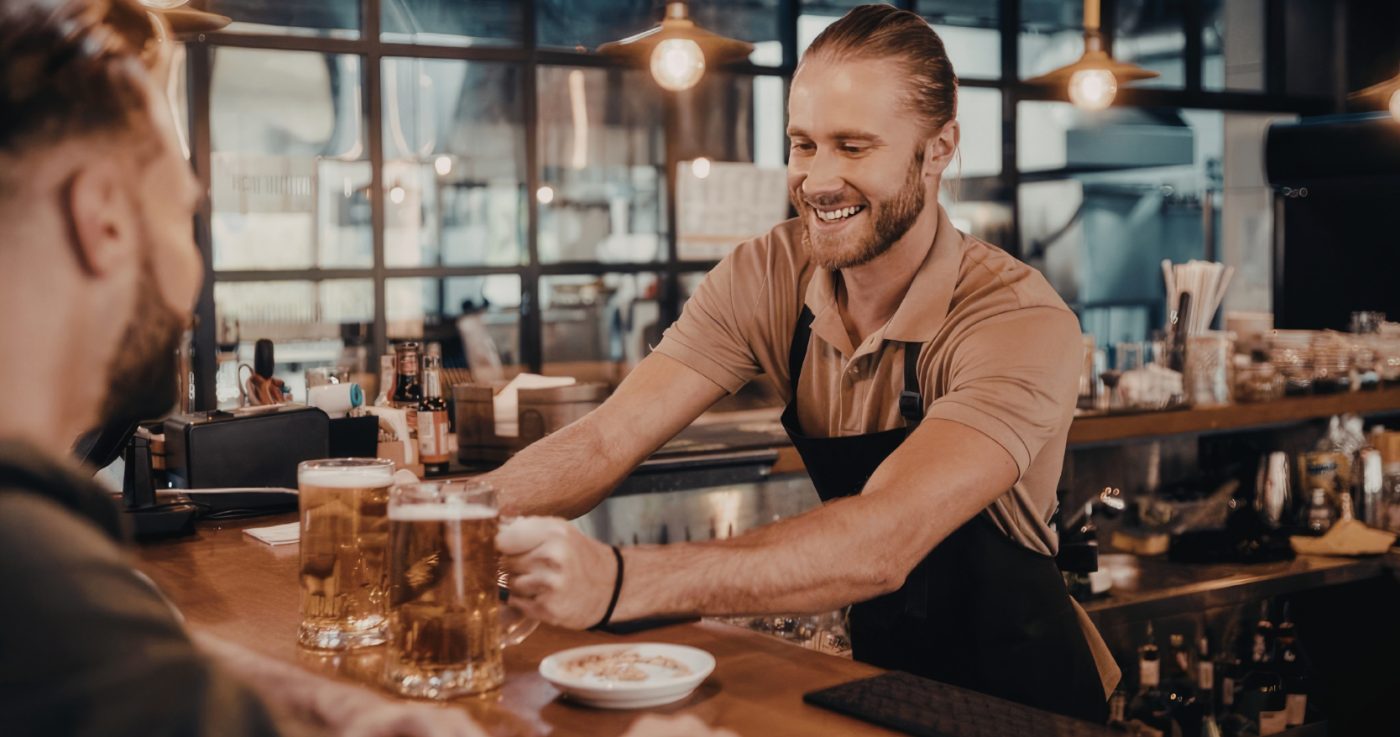 Bartender serving a member pub